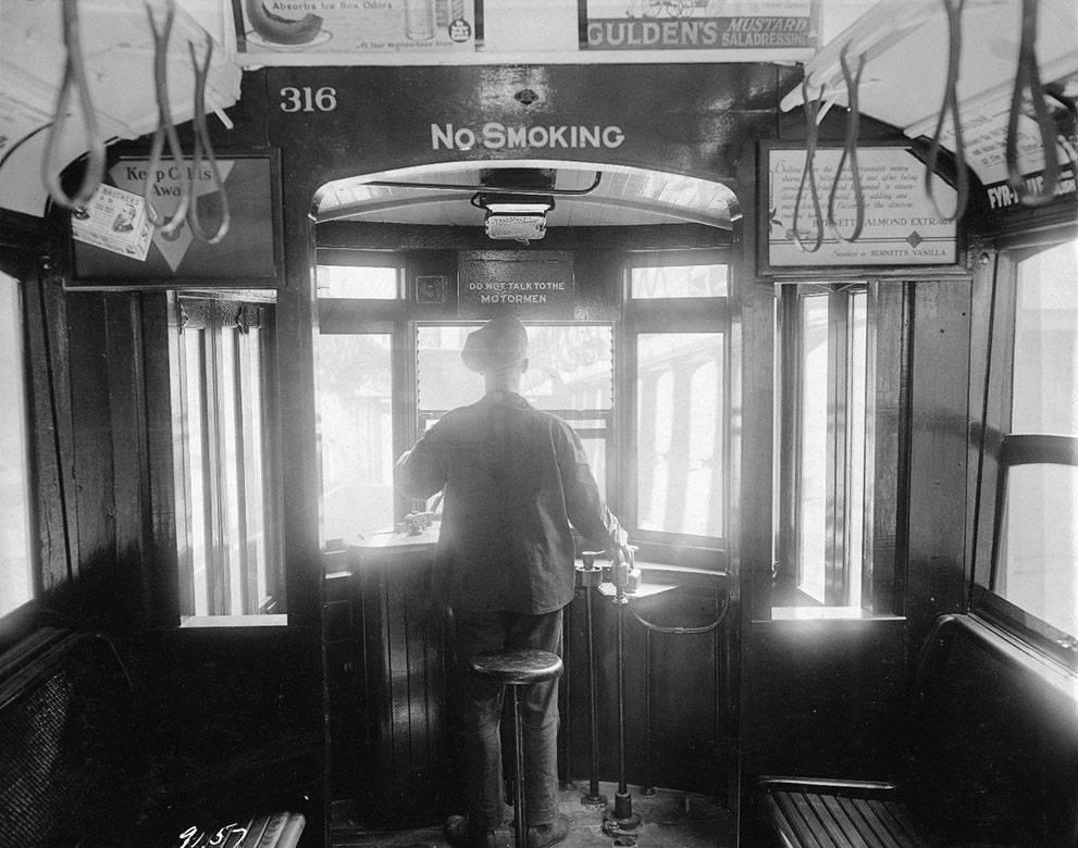 A motorman operates a trolley cars near