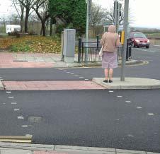 Using a zebra crossing Stand on the pavement beside the zebra crossing.