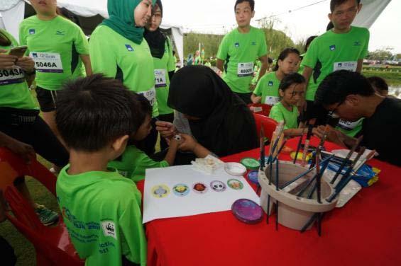 Parents and children, queuing up to get a WWF Malaysia