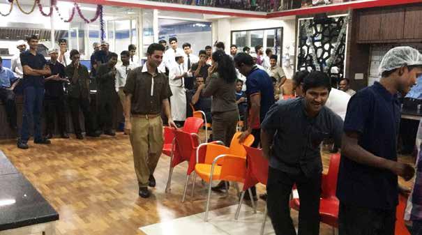 The Dining hall echoed with laughter and one could see the excitement on the faces of associates while some were running to grab their chairs and others dancing on the tunes while running around.