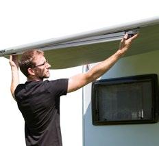which simply slides into the caravan rail. Open the sleeve and unroll the awning.