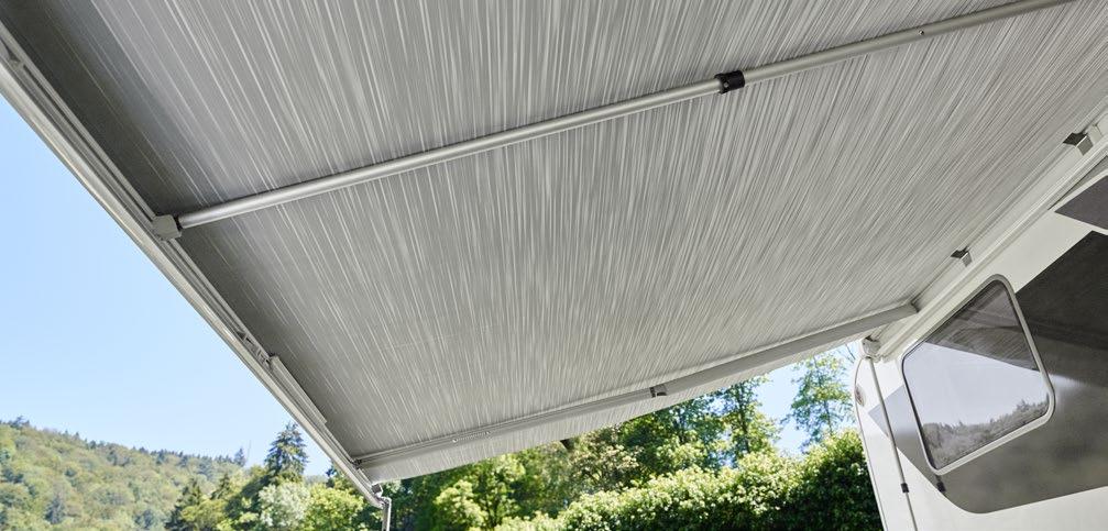 It is installed over the awning length between the spring arms and the fabric.