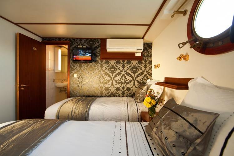 All cabins have fixed portholes, own shower & toilet, air conditioning, and flat screen TV.