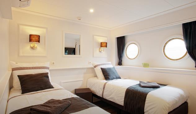 Lower deck cabins have fixed portholes. The upper deck has 4 beautiful suites (approx.