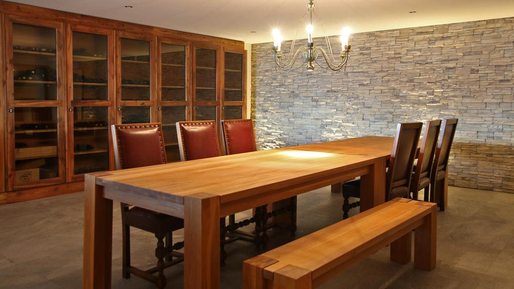 Wine & Fondue Room: The Site: Spacious, well-lit and styled with fine timber and stone, this sleek room on the first floor is the perfect place to host a dinner with friends or extended family.
