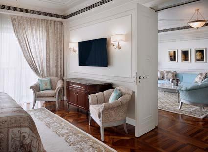 The bedroom includes a king size bed with Versace linen and a uniquely designed dressing