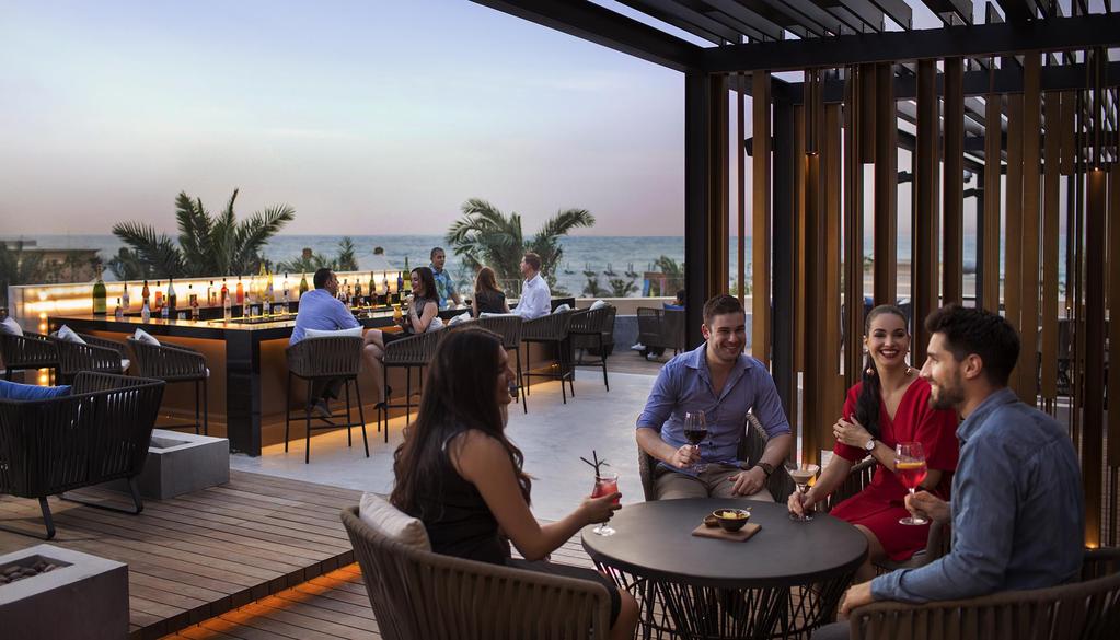 Enjoy a chill vibe on the rooftop overlooking the sea as