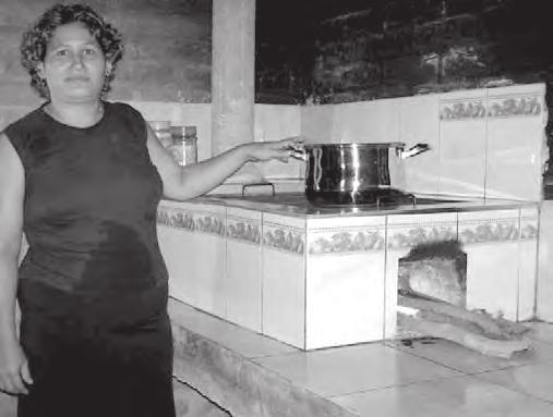 Figure 28: Example of a stove that has bee persoalized with a ceramic exterior. Photo courtesy of Agua, Arboles y Pueblo, El Salvador Figure 29: Commuity promoter of improved cookstoves, Hoduras.