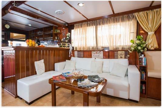 with bar area and LCD TV PA system for announcements by the captain or Cruise Manager Lounging sundeck with a total surface of over 2,300 sq ft and with deck-beds