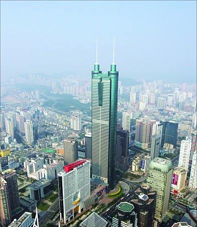 The Municipality of Shenzhen, China Shenzhen is a coastal city, close to Hong Kong in South China. The city is in the south of Guangdong Province, and separated from Hong Kong by Shenzhen River.
