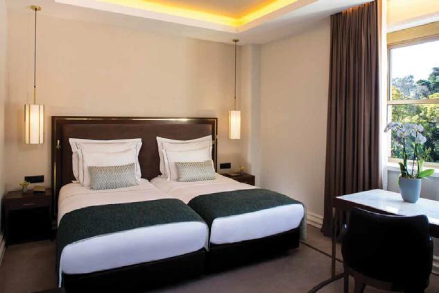 Classical in design, they have double or twin beds, a desk with two chairs and a fully equipped bathroom with walk-in shower or bath  Deluxe Room These classical designed rooms