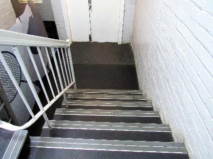 The entrance stairwell is reached immediately upon entering the building.