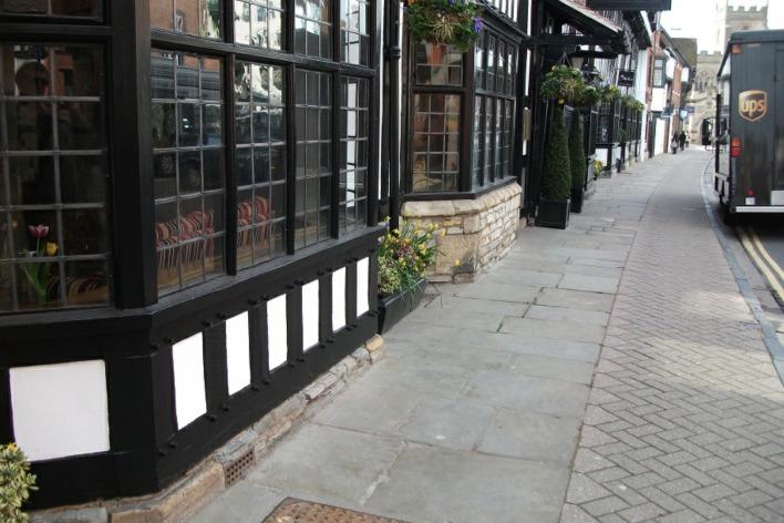 Many of the older buildings are of tudor origin with timber frames. Often the frames are set on stone foundations made from local limestone (Lias). The Shakespeare Hotel is one such.