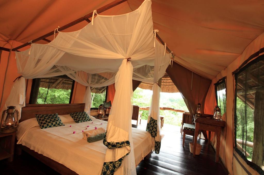SEMLIKI SAFARI LODGE Occupying an enviable location between the foothills of the Mountains of the Moon and the brooding mass of Lake Albert, Semliki Safari Lodge is the ideal spot from which to