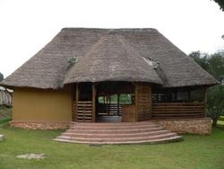 There are spacious and tastefully designed self-contained grass-thatched cottages with private wooden balconies perched over the rolling savannah of Queen Elizabeth National Park.