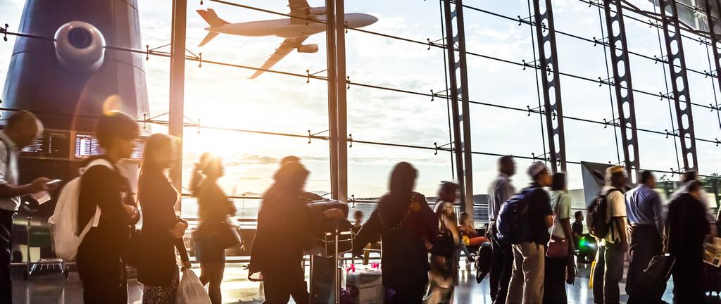 The Frictionless Future of Facial Recognition THE NEW WAY FOR TRAVELERS TO GET FROM THEIR GATE TO DESTINATION BY USING THEIR FACE Leather briefcase slung over her shoulder and boarding pass in her