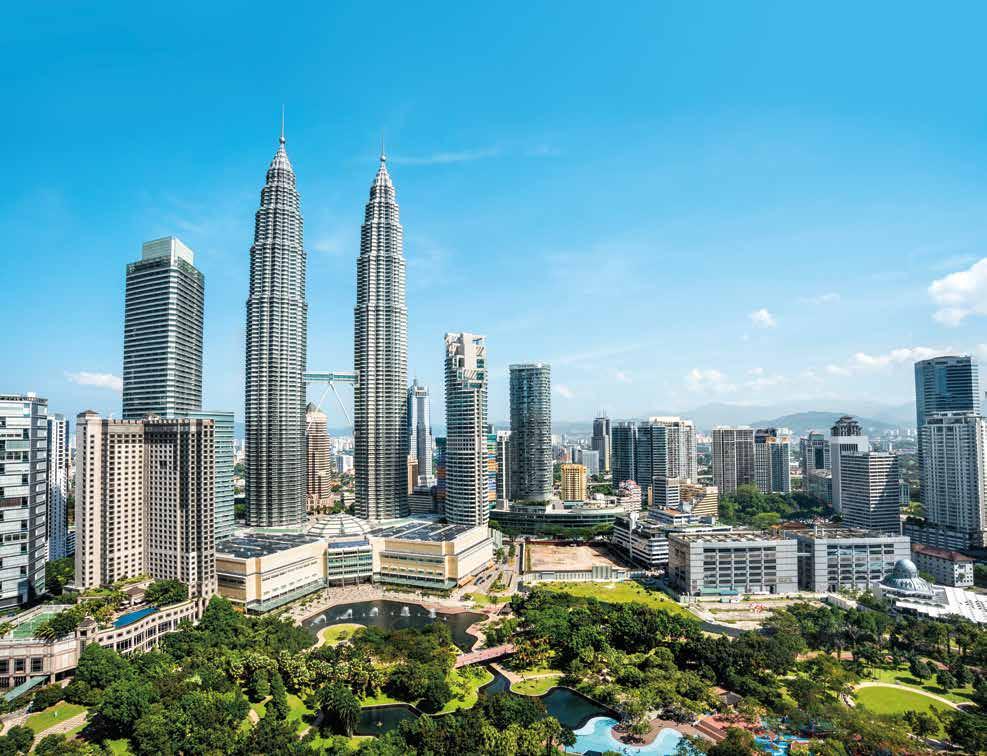 uncover The city of Kuala Lumpur boasts massive, glass skyscrapers that are complemented by colonial architecture.