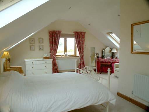 Built in dressing table, Windows and three Velux rooflights. Storage under eaves.