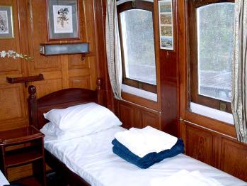 The cabins and the salon are air-conditioned and have elegant raised wood panelling in the style of the classic steamships that once cruised these majestic rivers.