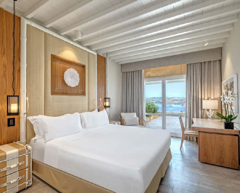DELUXE SEAVIEW ROOMS Designed to evoke beachside living, the Deluxe Seaview Room is crafted with wooden beams, neutral furnishings and bespoke pieces throughout.