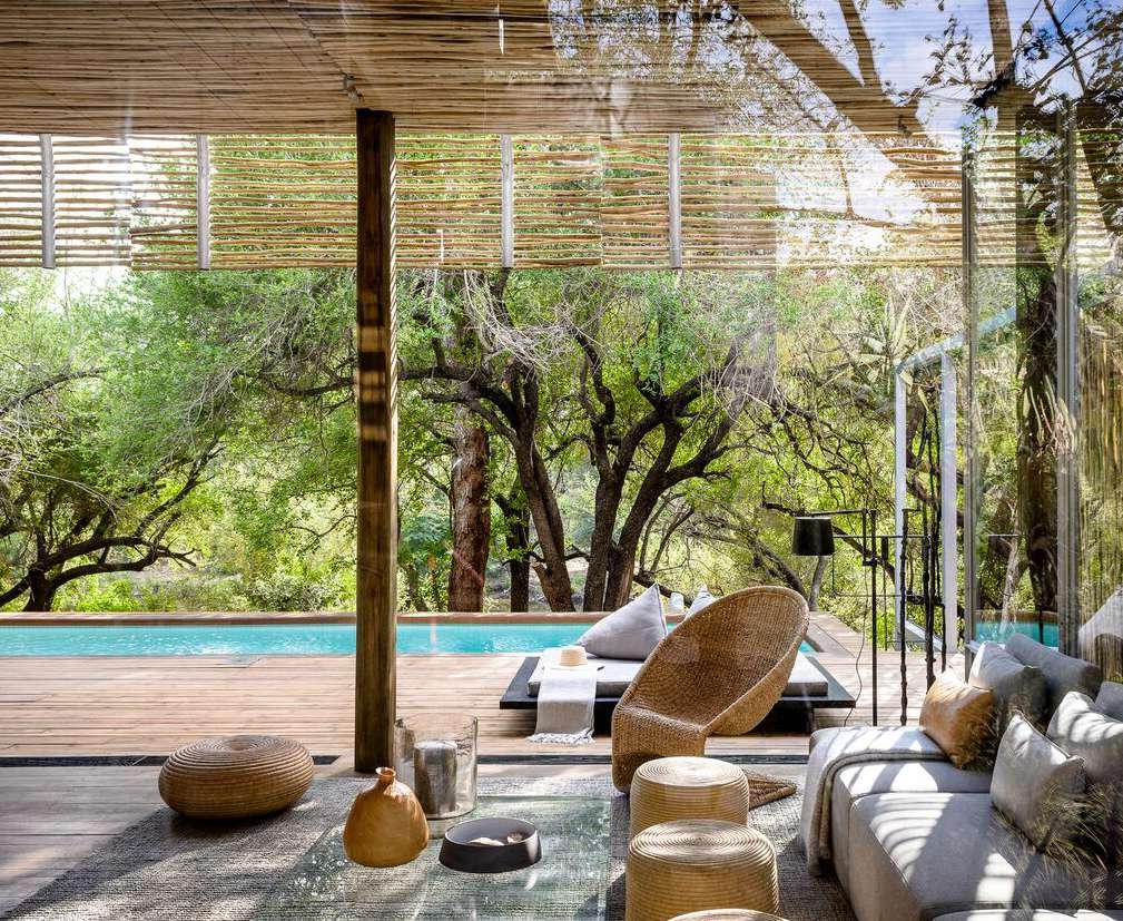SINGITA LEBOMBO VILLA Accommodation A light, sculptural and contemporary private villa, ensconced under mature trees on the banks of the picturesque N Wanetsi River in the Kruger National Park,