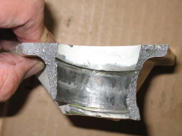 2.2. Forward Support Fitting. The Forward Support fitting is severed in 3 pieces; the 2 main parts were recovered, as they were still attached to the wing front spar.