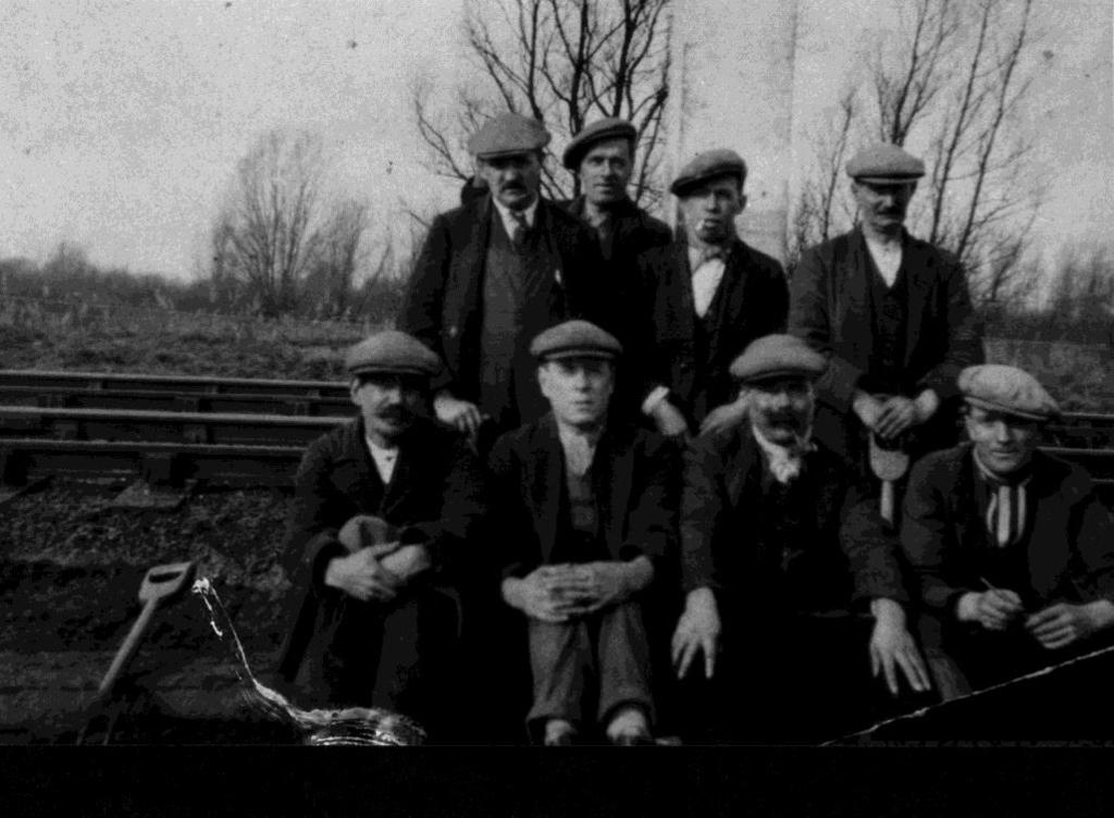 identifies John s grandson as the fourth man in the front row of a photograph of railway staff taken in