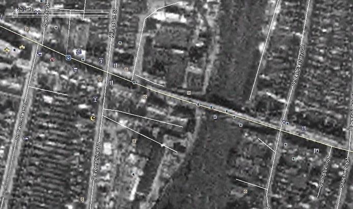 Post-war History : 1945 Present Day Figure 38 Aerial map of Mill Road from 1945 (Google Earth) The above image shows Mill Road Bridge in the centre, and the gap caused by the 1941 bombing is just