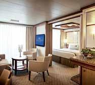 AMENITIES SUITE CLUB CLASS MINI-SUITE BALCONY with luxury furniture including two loungers, four chairs, table and ottoman with standard furniture including two to four