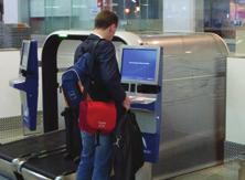 Passenger selects Airline via touch screen.