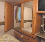 Strategically incorporated storage options abound mirrored wardrobe with clothes rail, spacious dresser,