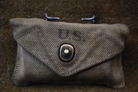 M1942 First Aid Pouch Commonly used to carry a US Army Carlisle bandage, named from the Carlisle Barracks Military Reservation where