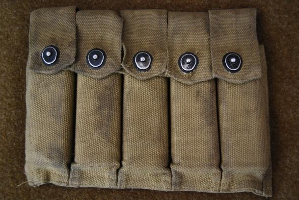 back of the belt clips into these) and the bottom row allows pistol holsters and first aid pouches etc. to be attached.