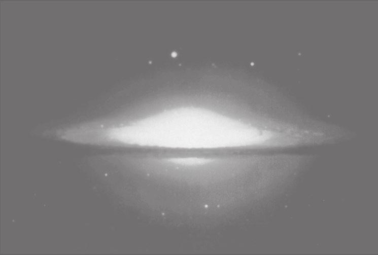 Sl. 1-2. Infracrvena fotografija galaksije imenom Sombrero, koja nam prikazuje njezin toplinski omotač.