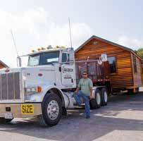 You may even see a massive log home being loaded onto a truck.