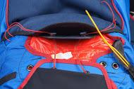 Push the packing cord through the upper flap grommet.