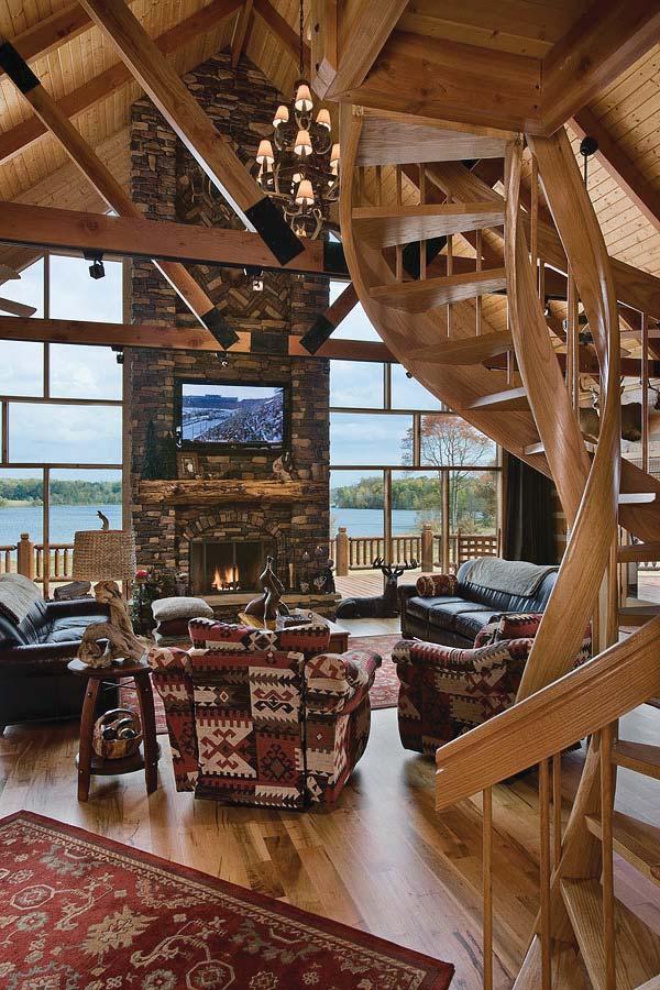 Hand-hewn log construction, stacked stone, plank floors and Hickory cabinetry create a cozy atmosphere, while flat screen