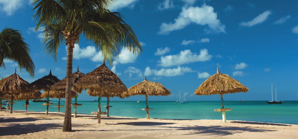 ARUBA S ULTIMATE INDULGENCE The powder-soft touch of sun-warmed sands. The gentle sway of fluttering palms. The azure sea veiling mile upon mile of tropical reefs.
