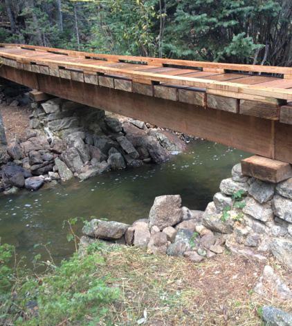 Rebuilt the entire bridge structure (~120 lf): o Replaced 7 failed log-crib abutments with new gabions.