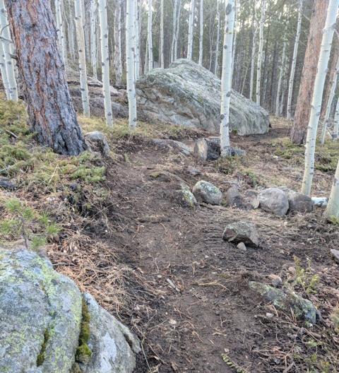 crowned tread o OTF over large boulder Close & Reclaim 500 lf of trail leading to