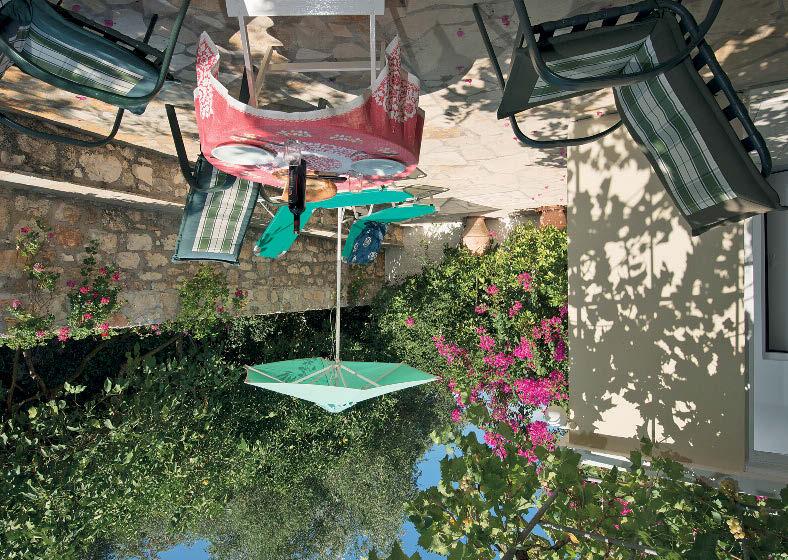 Dine in the pretty little courtyard under the old fig tree and grapevine, or peek through the apricot tree and fuchsia flowers on the front veranda for views across the straits to the mountains of