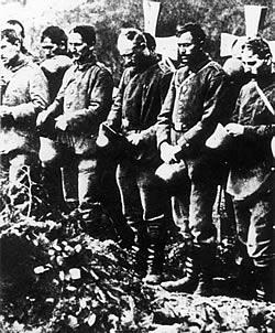 Emil Krieger, the Munich Sculptor Professor was inspired by a photograph taken in 1918 of soldiers mourning at