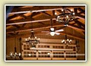 kitchen, pleasing architecture of soaring barn-style rafters with ironwork chandeliers, a barn