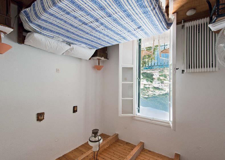 Each of the three bedrooms in Costa's House opens straight onto its own balcony overlooking the little town's