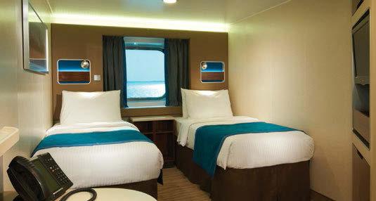 OCEANVIEW STATEROOMS Windows offer views of the latest port. All feature two lower beds that convert to a queen-size bed.