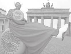 THE NEW LIGHT OF MYANMAR Friday, 21 January, 2005 13 A woman dressed in a traditional Dutch costume poses in front of the Brandenburg Gate during a promotional event advertising Dutch cheese as part