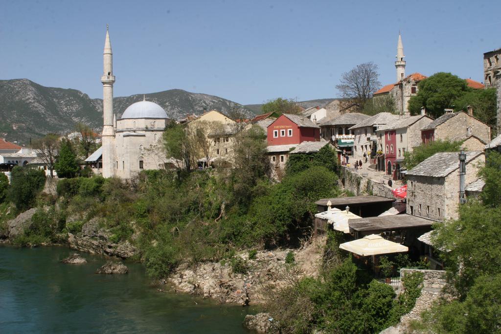 Mostar, Bosnia Mostar means bridge-keeper. The old Turkish bridge once was the only means uniting the city over the emerald waters of the Neretva River.