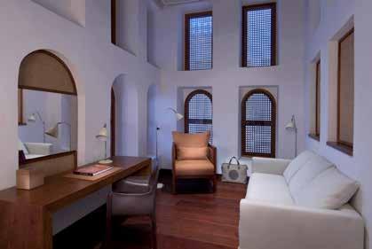 stunning Arabic style, featuring contrasting white walls and dark wooden floors and