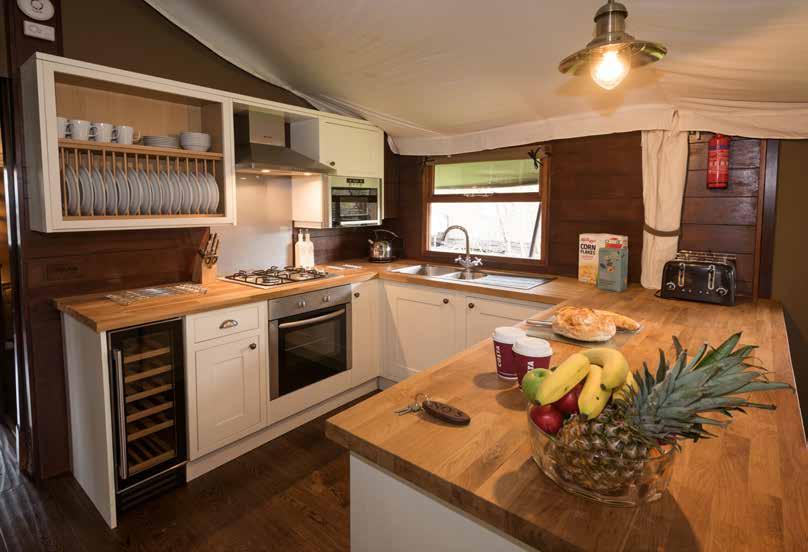 Separate seated dining area with table to seat 8 (3 bed) and 6 (2 bed) Fully fitted kitchen with full size fridge freezer, wine cooler and dishwasher Shower room with