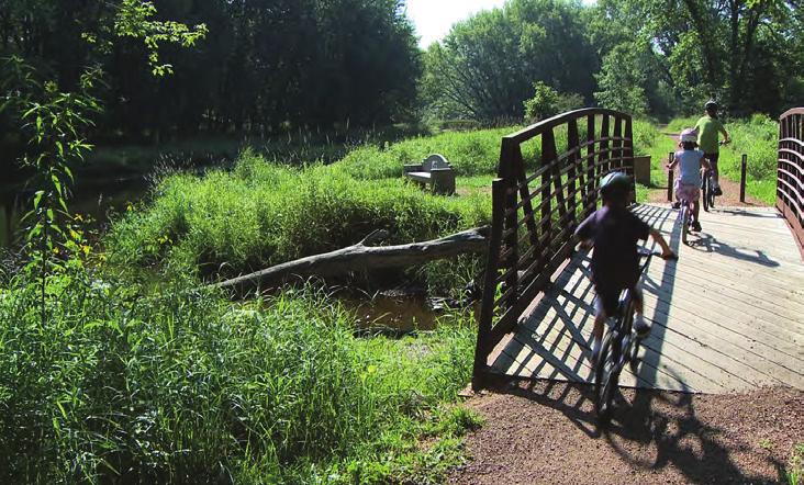 Advances opportunities for land-based trails, picnic spots, and other activities along the river. Provides a consistent and appealing image through signage and informational materials.